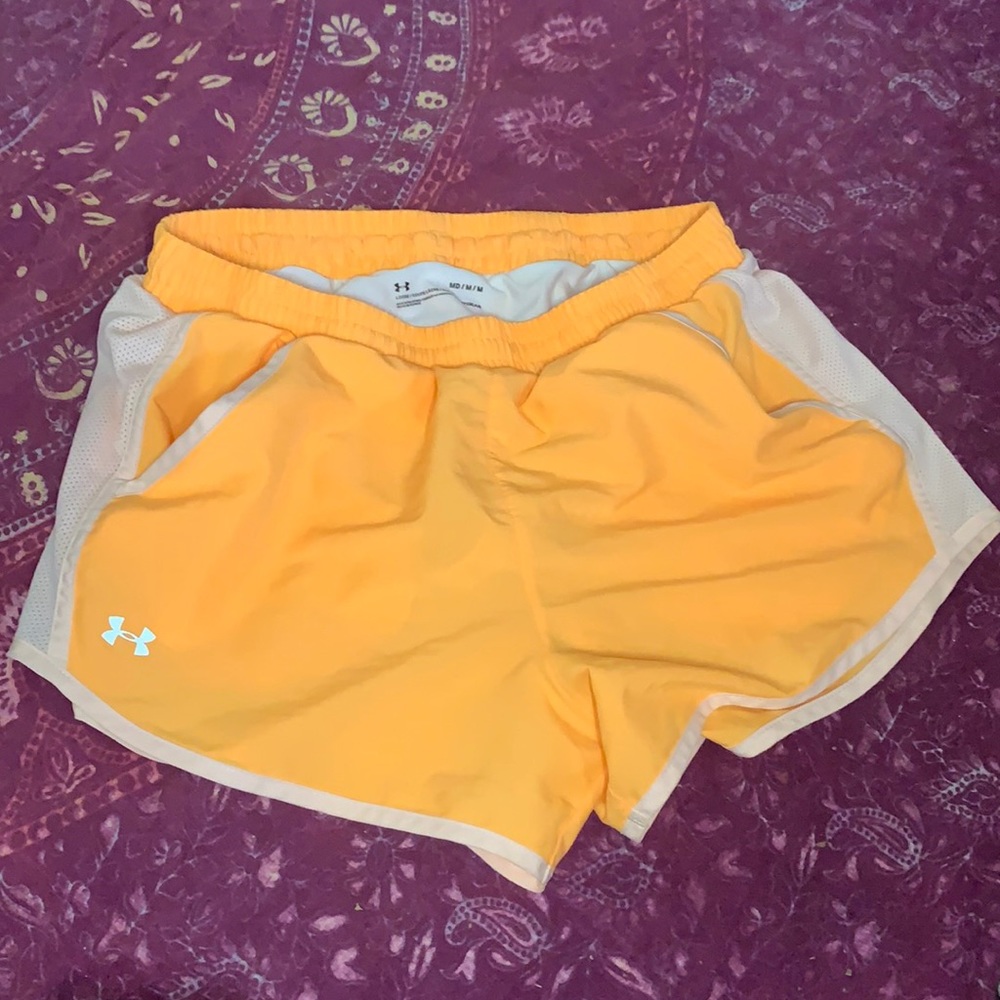 Neon orange under Armour running shorts pockets